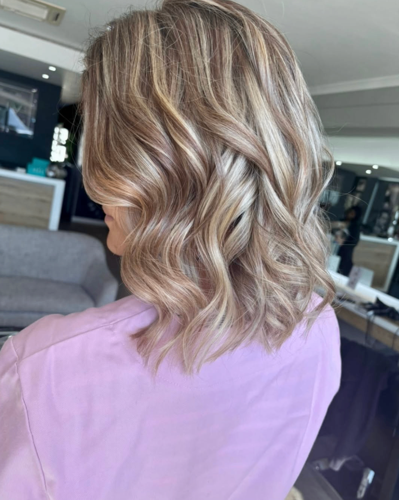 Shoulder-length bronde waves with blonde highlights, styled at Liv Hair Studio