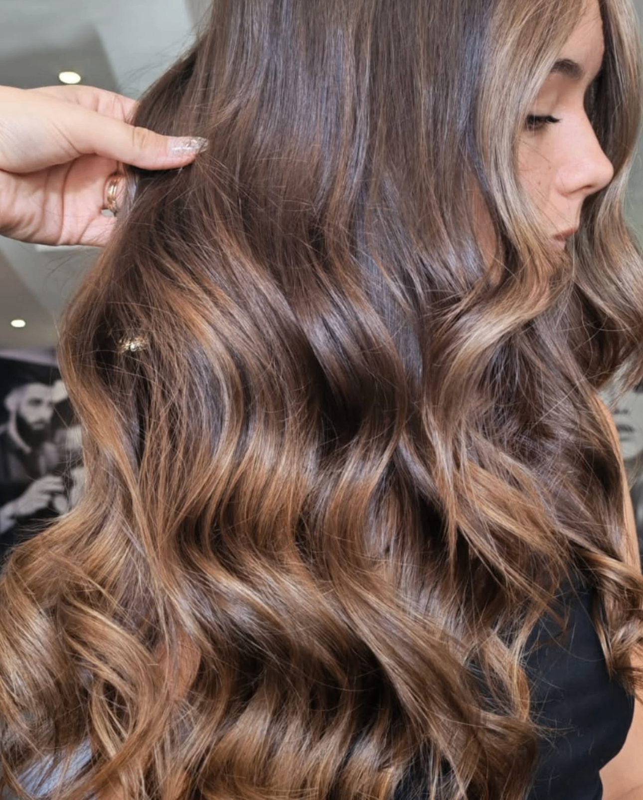 Glossy brunette balayage waves styled at Liv Hair Studio