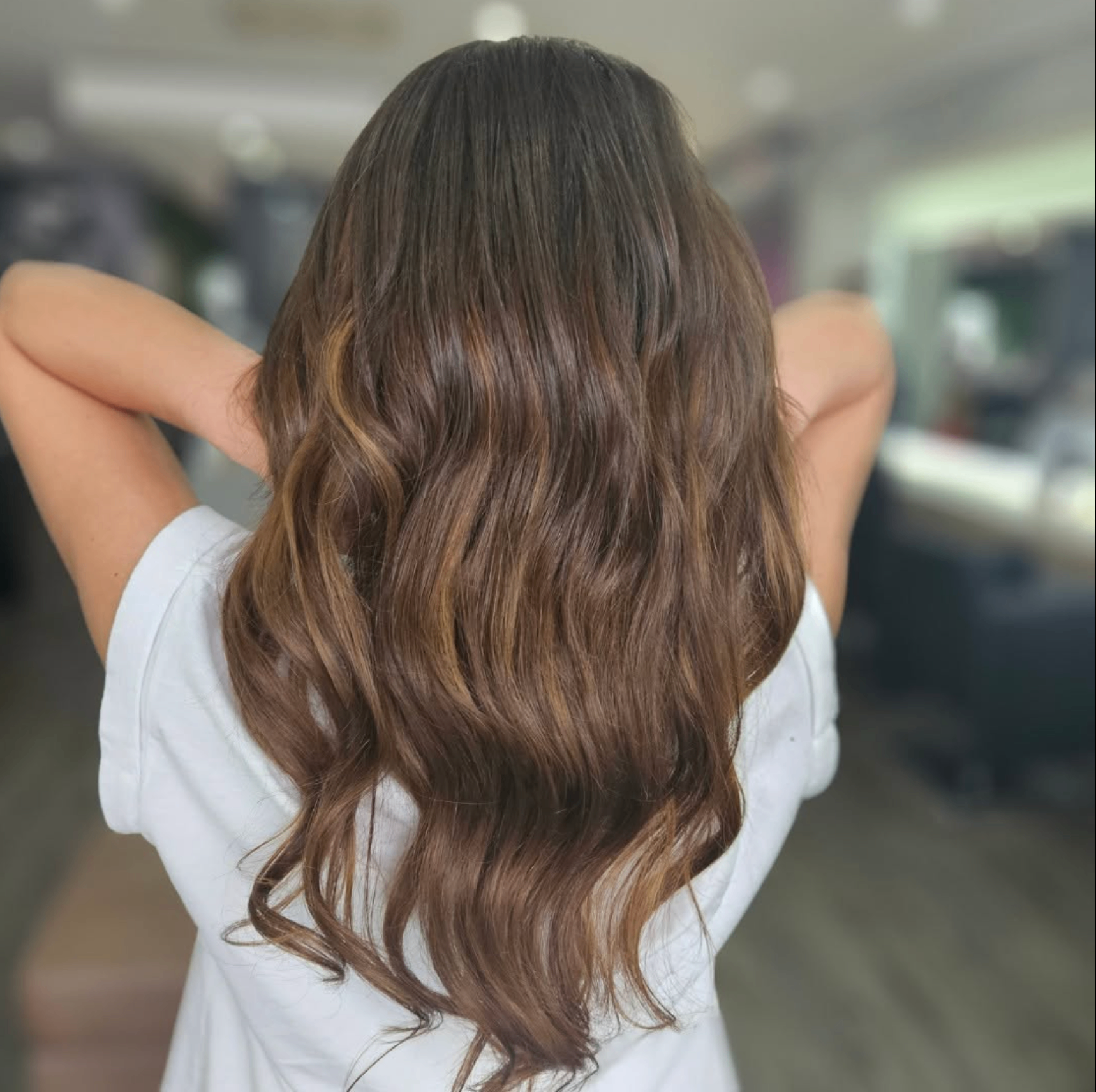 Long brunette soft bridal waves styled at Liv Hair Studio